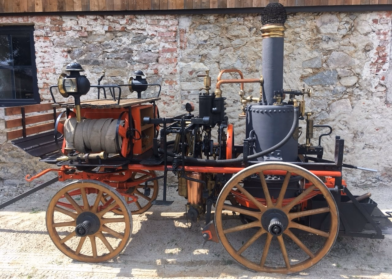 Machine #1 left-side view showing the restored boiler and pump assembly